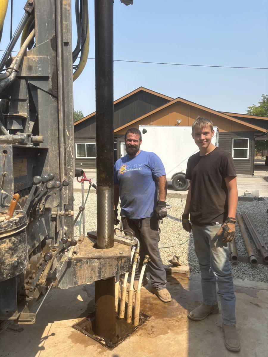 Aqua Terra crew pulling stainless steel well screen at a residential wellhead to deepen an existing well